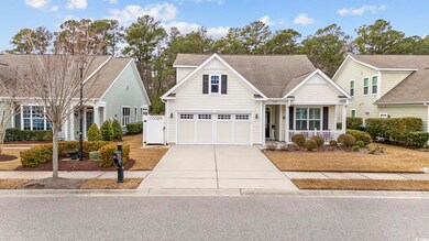 View of front facade featuring a porch and a garage