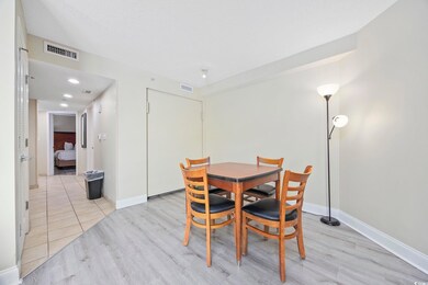 Dining space featuring light hardwood / wood-style