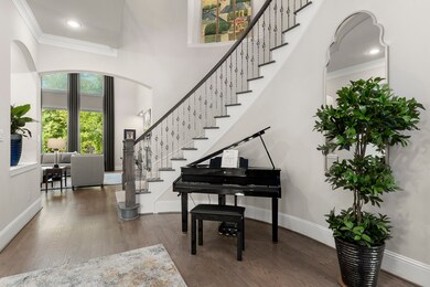 Gorgeous curved staircase with art niche at the bottom