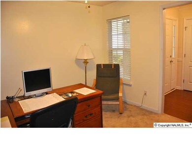 Study has recessed lighting and is open to foyer