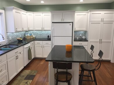 Custom built cabinets, granite counter tops, marbl