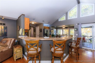 Open floor plan with breakfast bar