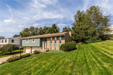 FRONT OF HOUSE:  Mature landscaping allows for a b