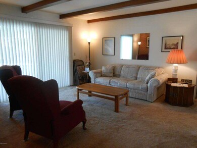 Living room w/beamed ceiling