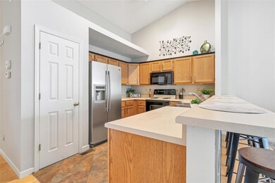 Additional view of kitchen with vaulted ceiling, b