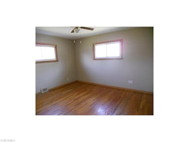 Master Bedroom with Hardwood Floors and Newer Wind