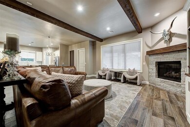 Living room featuring beamed ceilings