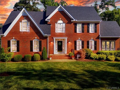 Colonial-style house with a lawn