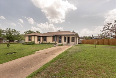 Front view shows that the home is set back from th