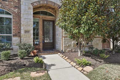 Mature landscaping shrouds the front entrance and backyard.