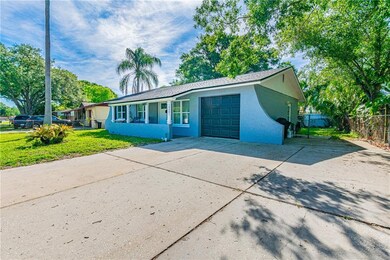 House offers extended driveway that can fit 4 cars