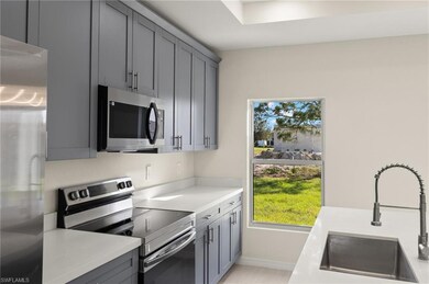 Kitchen with sink, appliances with stainless steel