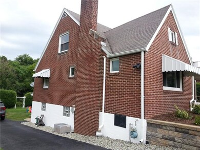 Freshly painted foundation and side view of home