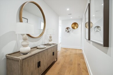 Featuring wide-plank hardwood floors and soaring c