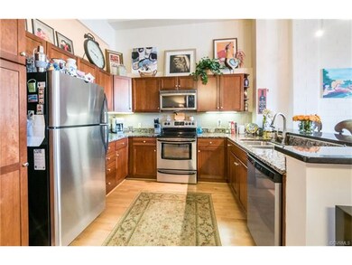Kitchen includes stainess steel appliances and gra