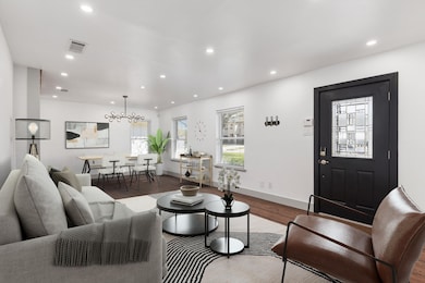 Fabulous recessed lighting, beautiful large open dining and living room with gorgeous real hardwoods