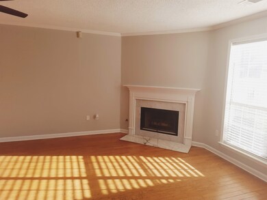 Living room features hardwood floors, floor-to-cei