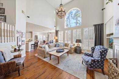 A cozy family room featuring a stylish chandelier,