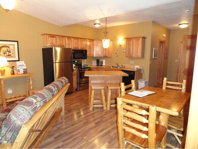 Spacious family room with gas fireplace, flat scre
