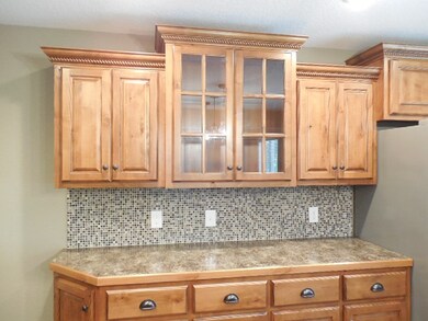 Special knotty alder cabinetry throughout kitchen.
