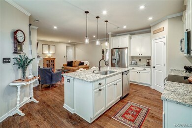 Kitchen with stainless steel appliances, pendant l