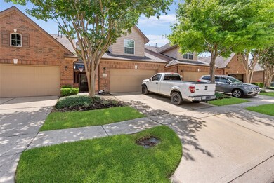 Exclusive entryway leads to a spacious driveway, o