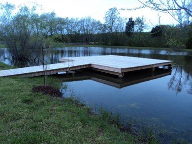 This lot has a wonderful pond on the property with a deck going out into the water.   The pond make a great place to relax and enjoy the wildlife of wild geese, grey.stork and deer and turkey that hang out.  Or you will enjoy the fun of fishing.