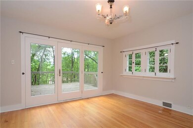 The light and bright dining room features hardwood