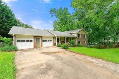Split-level home with covered porch, brick siding
