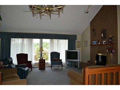 Living Room. Vaulted ceiling, wall of windows and 