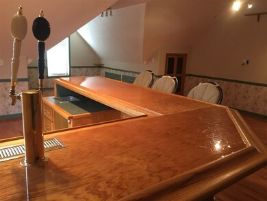 Bonus room with bar, hardwood floors, wired for su