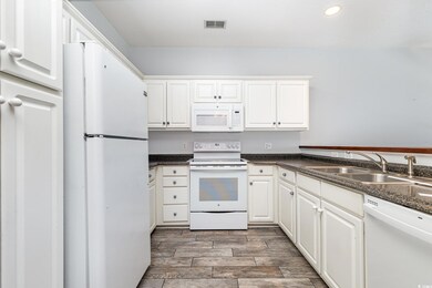 Kitchen featuring hardwood / wood-style flooring, 