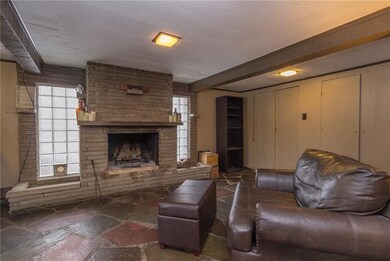 Brick Woodburning Fireplace in Oversized Family Ro