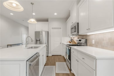 Kitchen with appliances with stainless steel finis