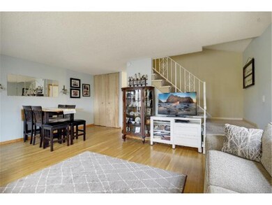 Living room and dining area and stairs to upper le