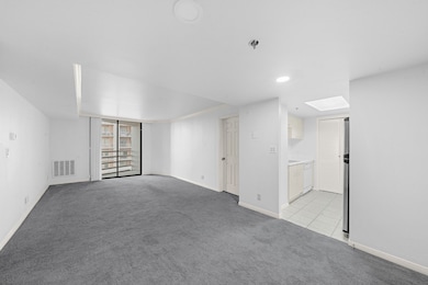 Open floor plan flows directly to private balcony