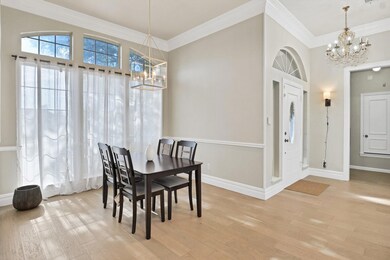 Dining space with crown molding, baseboards, a cha