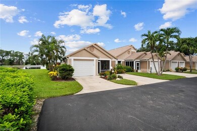 Ranch-style home featuring a garage and a front ya