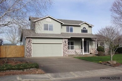 Front of home showing small gated RV area