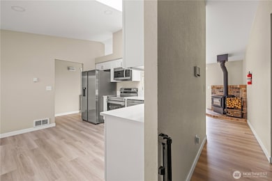 Open sightlines from the kitchen to the living area, creating a true great-room layout. Ideal for gatherings and keeping connected between spaces.