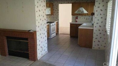 Easy living in this Family Room with fireplace ope