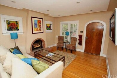 Living room has pretty windows overlooking the fro
