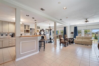 Living room with ornamental molding, visible vent
