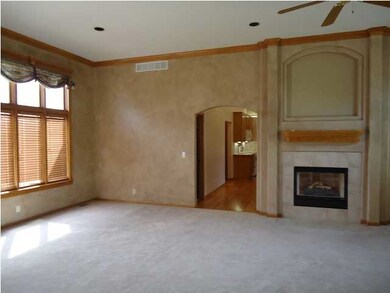View of living room into the hearth/kitchen room. 