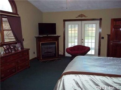 Master Bedroom. French doors lead to pool and deck