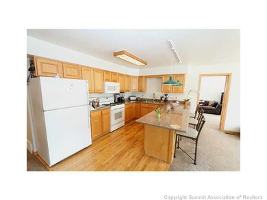 Kitchen. Kitchen features slab granite countertops