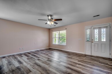 Entryway with hardwood / wood-style flooring and c