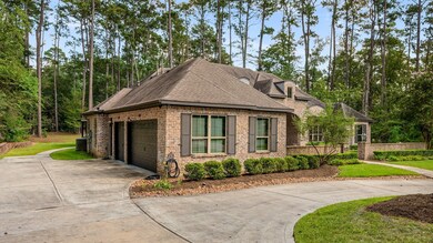 Expansive three-car garage and additional driveway