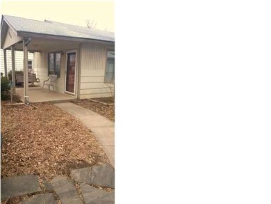 Sidewalks lead you to the front door and the garag