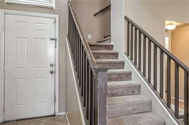 Staircase featuring tile patterned flooring